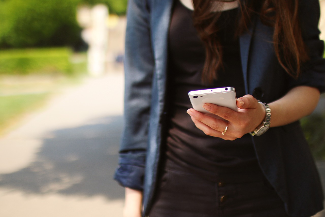 girl walking with cell phone