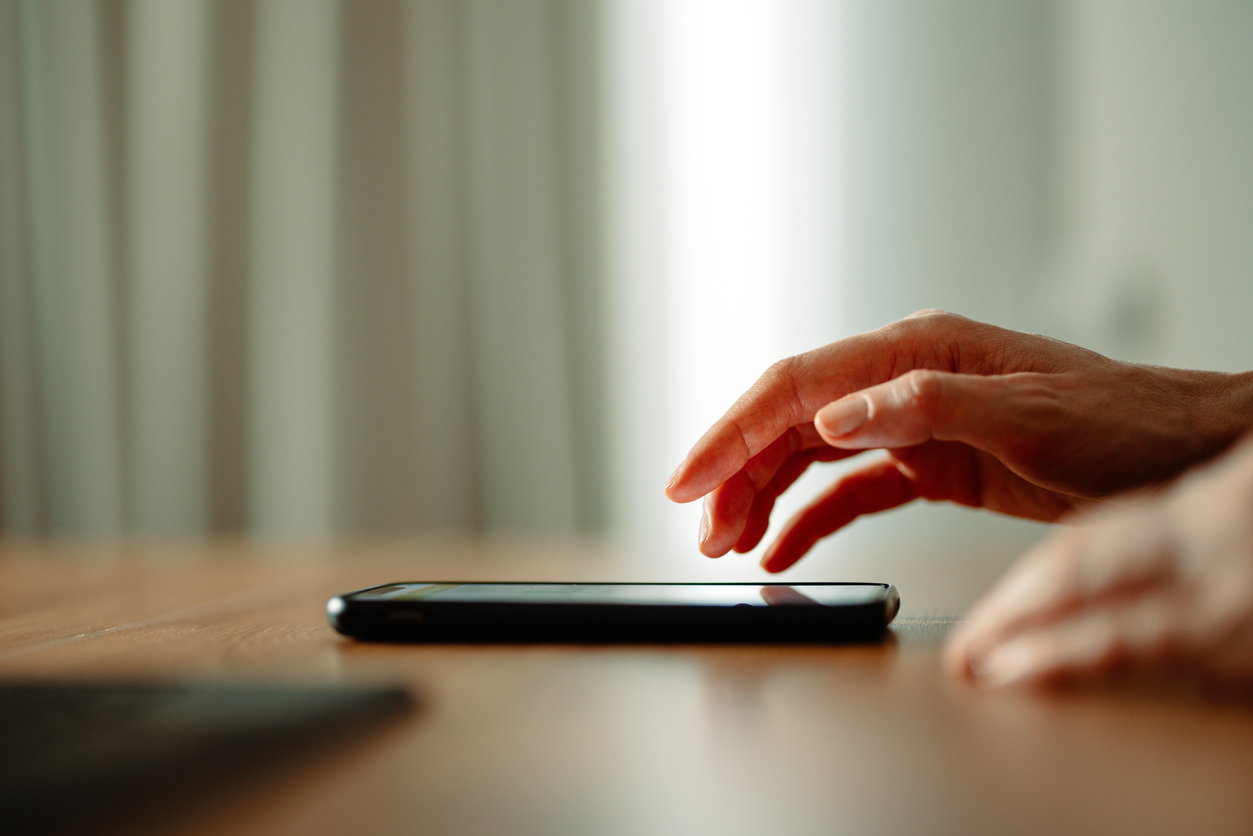 woman hand using mobile phone